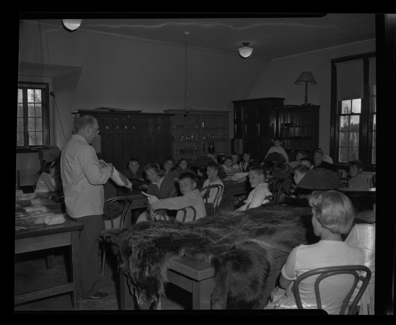 Dr. Earl J. Larrison showing grade school class from Kendrick some animal specimens.