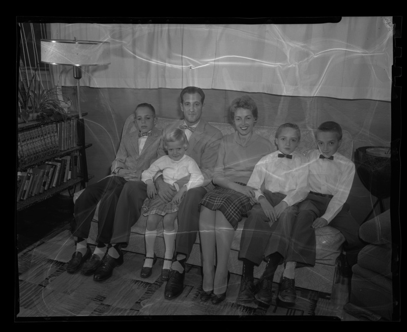 Senator F. William "Bill" Bergeson poses with his family after winning  an "All-American Family" photo contest. From left to right: David, Bill Bergeson, Stacy on her father's lap, Bonnie Bergeson, and twins Stanley and Steven.