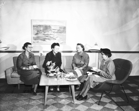 Margret Ritchie, Professor of Home Economics at the University of Idaho, receiving a silver coffeepot from the Moscow Homemakers Club.
