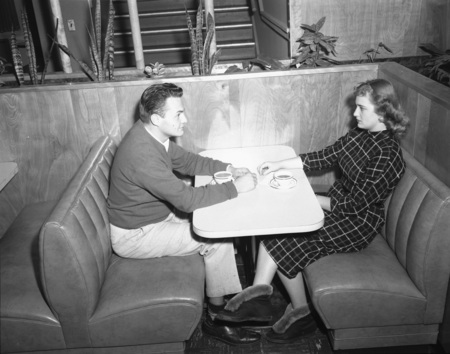 Two students grabbing a cup of coffee in the University of Idaho Student Union Building.