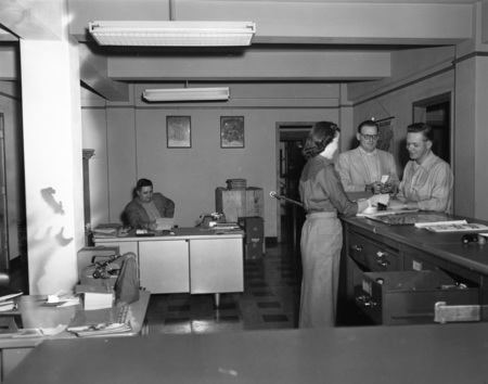 Gale Mix, ASUI General Manager, sits at his desk in the Student Union Building with his staff.