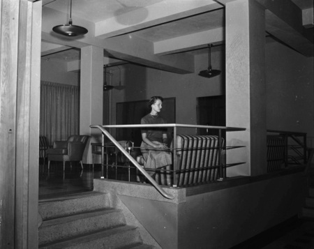 A student sitting in a common area of the Student Union Building