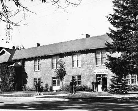 A photograph of students standing outside of the Student Bookstore.