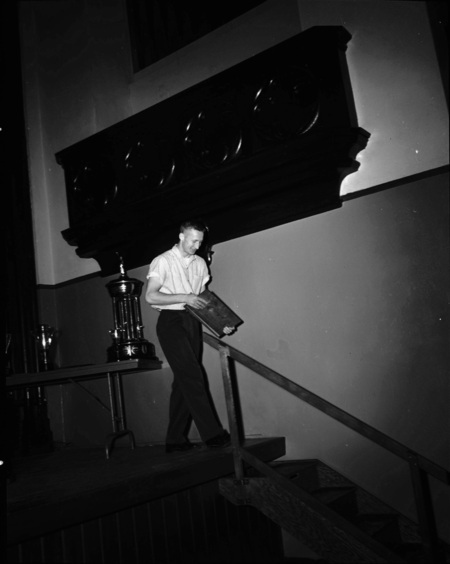 President Theophilus handing out awards at assembly.