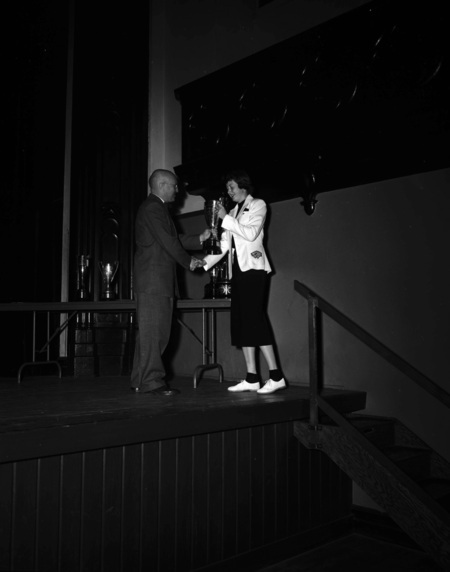 President Theophilus handing out awards at assembly.