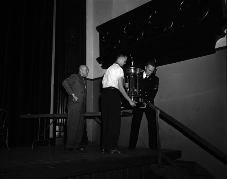 President Theophilus handing out awards at assembly.