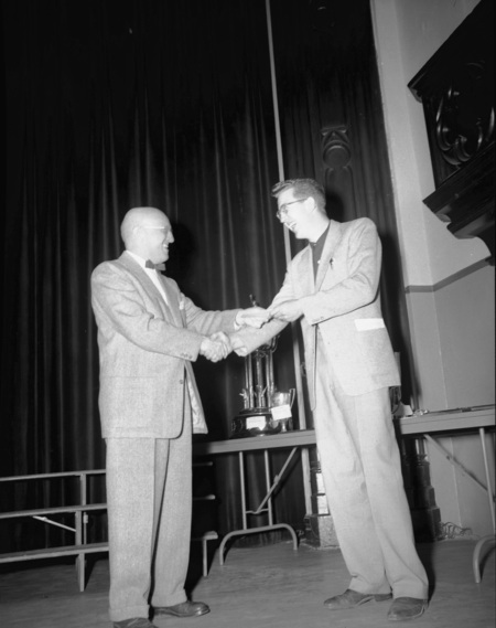 University of Idaho President Theophilus handing out awards.