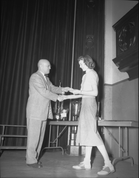 President Theophilus handing out awards at assembly.