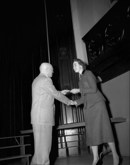 President Theophilus handing out awards at assembly.