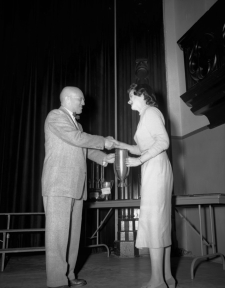 President Theophilus handing out awards at assembly.