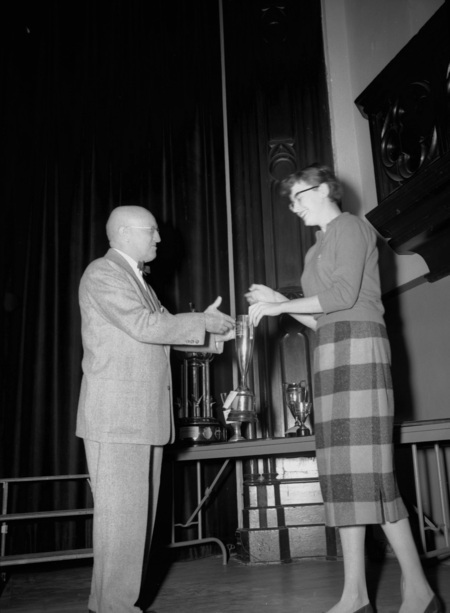 President Theophilus handing out awards at assembly.