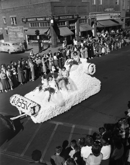 The Homecoming Queen float driving with the Homecoming Parade.