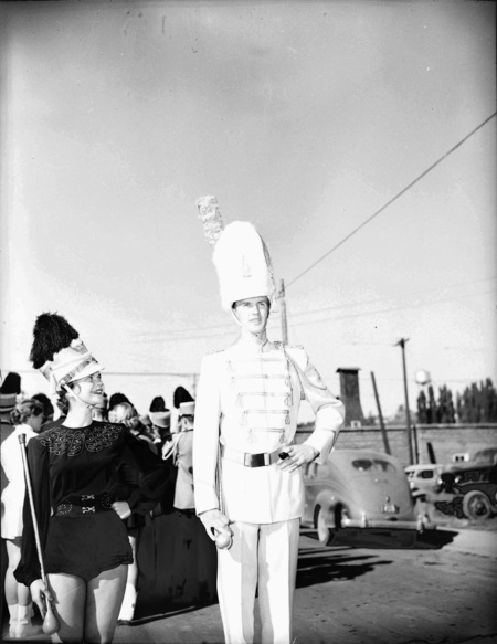 Majorette Bonese Collins and Drum Major Stanley Blackwell stand next to each other before the Homecoming football game.