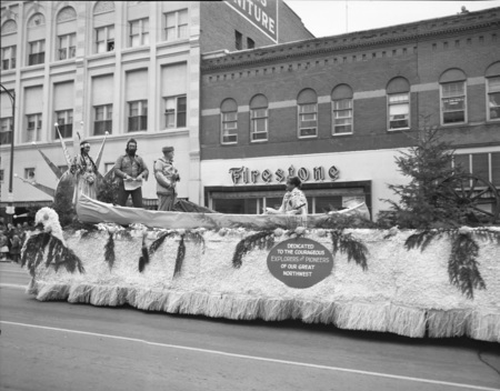 Students in costume on a float during Homecoming Parade.
