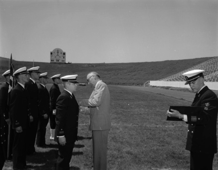 University President Theophilus giving out awards at Navy ROTC ceremony.