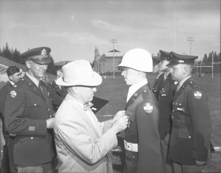 University President Theophilus giving out awards at the Army ROTC ceremony.