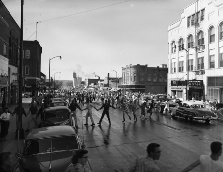 The crowd holding hands at the Homecoming parade in downtown Moscow.