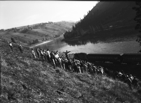 Students gather on a hillside during geology field trip.