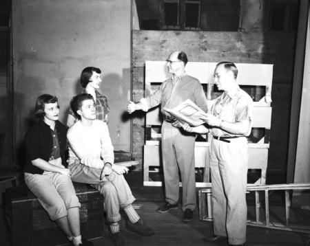 Choir students receive instruction from faculty.