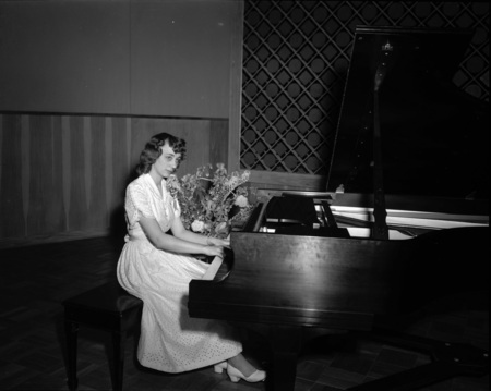 Student Bonne Allee poses at piano.