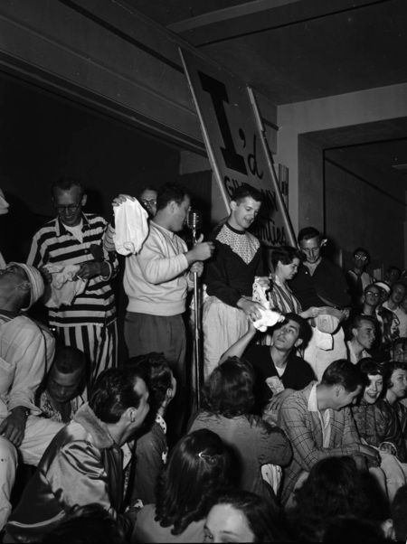 Students hold a panty raid with signs that read: "I'd give my panties for a crippled kid".