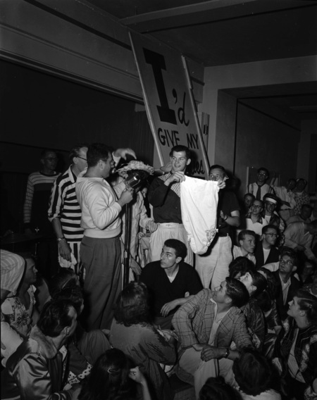 Students hold a panty raid with signs that read: "I'd give my panties for a crippled kid".