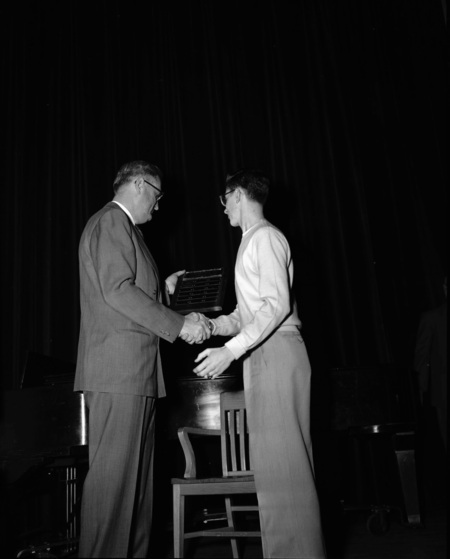 University of Idaho president J.E. Buchanan handing out awards.