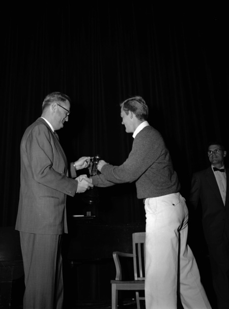 University of Idaho president J.E. Buchanan handing out awards.