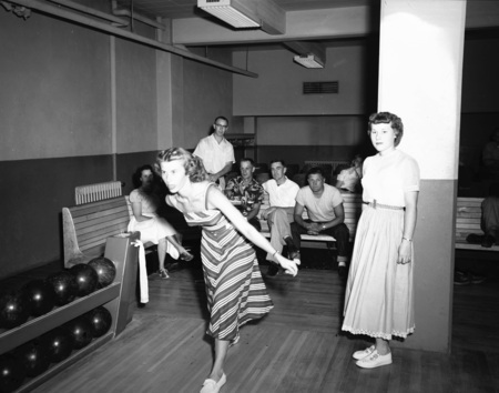 Student bowls for summer bowling class.