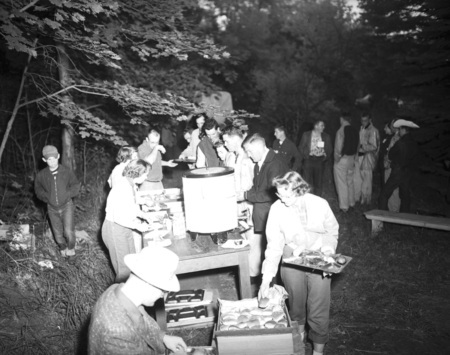 Students line up for food outside.