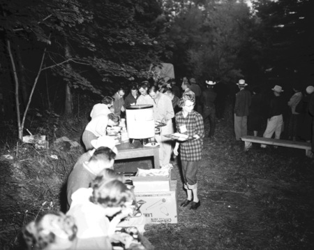 Students line up for food outside.
