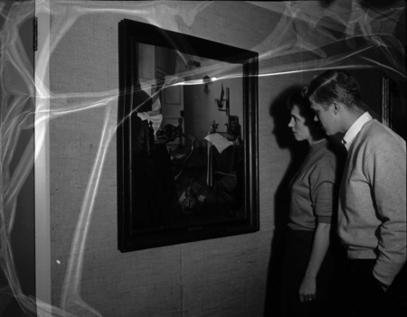 Art and Architecture students looking at IBM painting "Home of the Artist."