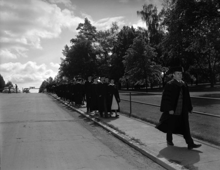 Faculty lead the procession to Memorial Gym where Commencement is held.