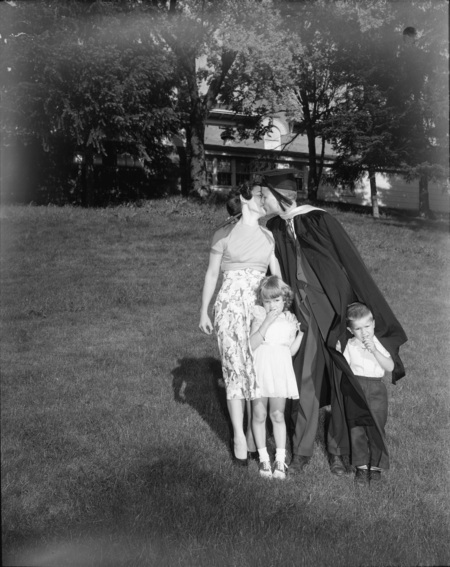 Harlan LeFever with wife and children at commencement.
