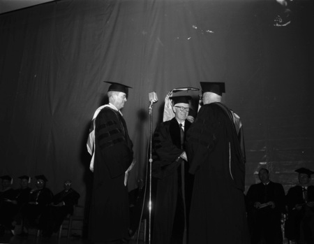 Judge William Healy receiving an honorary Doctor of Laws degree from the University of Idaho.
