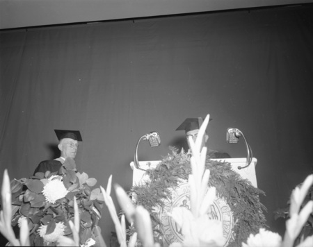 Retiring Professors Claude W. Ashby and J. Hugo Johnson speaking at commencement.
