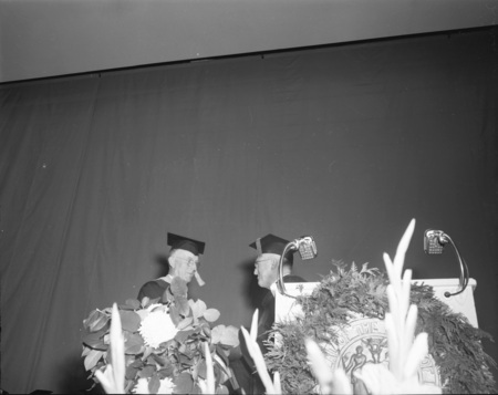 Retiring Professors Claude W. Ashby and J. Hugo Johnson speaking at commencement.