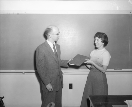 Student Louise Tatko Cummins receives award.