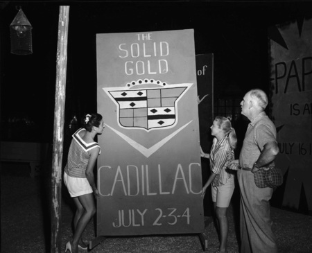 Cecil Matson, Mary Ellen Bennett, and Nancy Moen arrange scenery flats