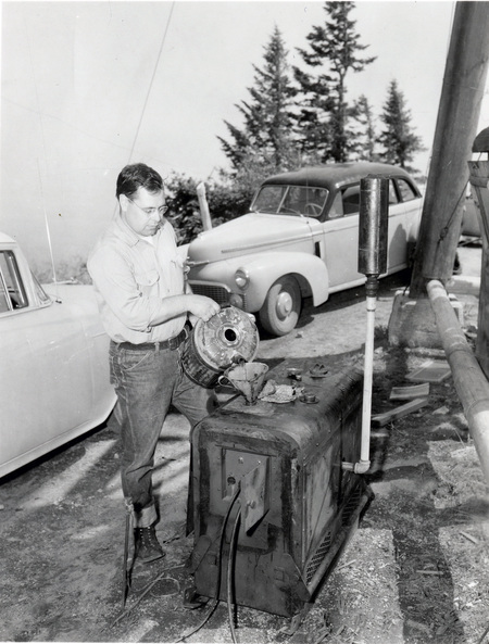 College of Forestry Lloyd B. Craine filling generator tank at fire detection conference.