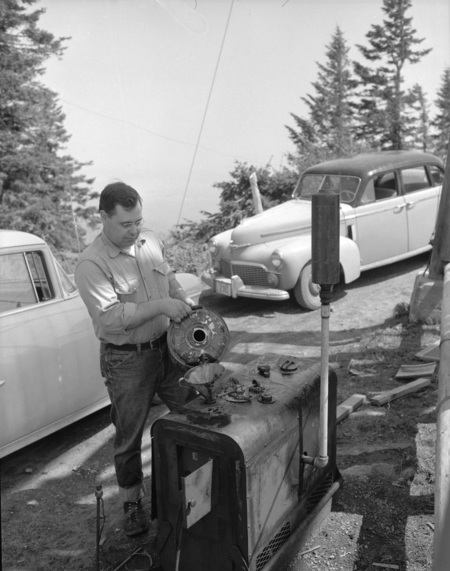 College of Forestry Lloyd B. Craine filling generator tank at fire detection conference.