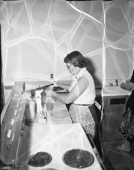 Home Economics student working at a stove.
