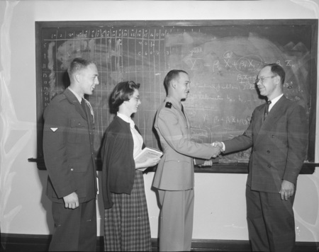 British consulting general C.C. Whiteridge discussing the Middle East with students.