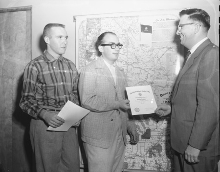 Students receiving agriculture newsletter award (l-r): Anton Smutny, Buhl; Thomas Cooper, Idaho Falls; and Assistant Professor Duane LeTourneau.