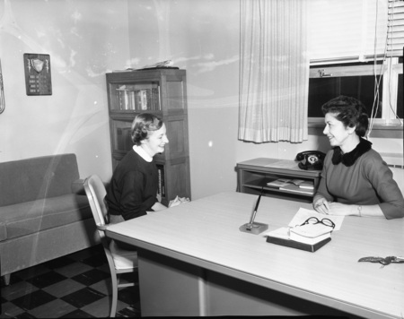 Student conferring with Marjorie Neely, Associate Dean of Student Affairs for Women at the University of Idaho.