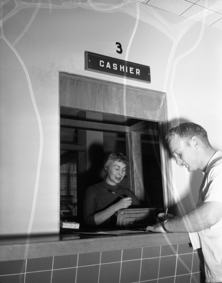 Number 3718 for the academic year, Lamont Anderson breaks the record for enrollment at the University of Idaho. He's seen registering at the registrar's window.