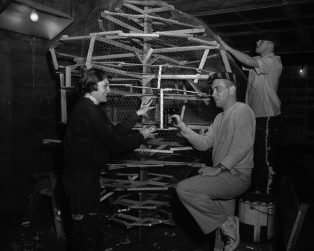 Students work together of the construction of the homecoming float.