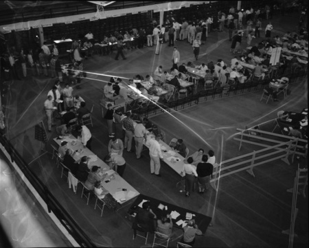 Students in registration lines at Memorial Gymnasium, University of Idaho.