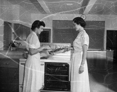 Two Home Economics students cooking potatoes.