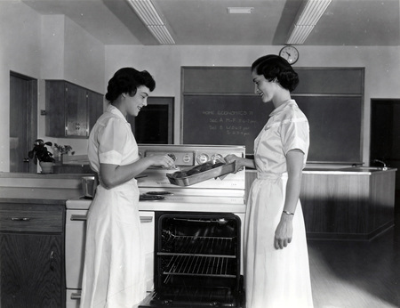 Two Home Economics students cooking potatoes.